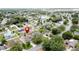 Aerial view of a residential neighborhood with a lake in the distance with a marker near a blue home at 238 Sunridge Woods Blvd, Davenport, FL 33837