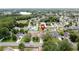 Beautiful aerial of a suburban neighborhood with a lake in the distance, with a marker at 238 Sunridge Woods Blvd, Davenport, FL 33837