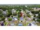 Aerial neighborhood view with a marker located near a blue single-Gathering home with a brown roof at 238 Sunridge Woods Blvd, Davenport, FL 33837