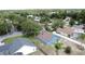 Expansive, tree-filled backyard on this blue home with a brown roof in a beautiful neighborhood at 238 Sunridge Woods Blvd, Davenport, FL 33837