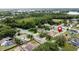 An aerial view of a residential neighborhood and a marker near a house surrounded by trees at 238 Sunridge Woods Blvd, Davenport, FL 33837