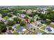 An aerial shot of a neighborhood with a marker located near a blue house with mature trees at 238 Sunridge Woods Blvd, Davenport, FL 33837