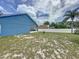 Expansive backyard featuring mature trees and lush greenery offers a private and tranquil outdoor space at 238 Sunridge Woods Blvd, Davenport, FL 33837