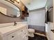 Charming bathroom with a modern vanity, hexagon tile floor, and a stylish shower curtain over the tub at 238 Sunridge Woods Blvd, Davenport, FL 33837