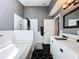 Bathroom with a combination shower and tub, subway tiles, modern vanity, and contrasting black hexagonal floors at 238 Sunridge Woods Blvd, Davenport, FL 33837