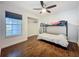 Bedroom with hardwood floors, a window, and a bunk bed for comfortable and functional living space at 238 Sunridge Woods Blvd, Davenport, FL 33837
