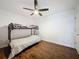 Spacious bedroom features wood floors, ceiling fan, and a black, twin-sized bunk bed at 238 Sunridge Woods Blvd, Davenport, FL 33837