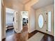 The entryway boasts hardwood floors and doors leading to bathroom and living spaces at 238 Sunridge Woods Blvd, Davenport, FL 33837