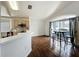 Eat-in kitchen with stainless appliances, breakfast bar, and sliding doors to outside at 238 Sunridge Woods Blvd, Davenport, FL 33837
