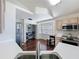 The kitchen features stainless steel appliances, ample counter space, and pantry shelving at 238 Sunridge Woods Blvd, Davenport, FL 33837