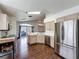Modern kitchen with stainless steel appliances, ample counter space, and hardwood floors at 238 Sunridge Woods Blvd, Davenport, FL 33837