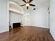 Bright living area featuring wood flooring, high ceilings, and modern fixtures at 238 Sunridge Woods Blvd, Davenport, FL 33837