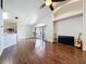 Open living room with wood floors, high ceilings, recessed lighting, and barstool seating at 238 Sunridge Woods Blvd, Davenport, FL 33837