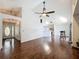 Spacious living room with hardwood floors, high ceilings, and a view of the kitchen at 238 Sunridge Woods Blvd, Davenport, FL 33837