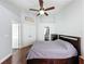 Primary bedroom showcasing wood flooring and natural lighting at 238 Sunridge Woods Blvd, Davenport, FL 33837