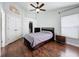 Main bedroom featuring wood flooring, a ceiling fan, and closet access at 238 Sunridge Woods Blvd, Davenport, FL 33837