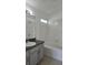 Well-maintained bathroom with a shower-tub combo and granite sink countertop at 2401 Cedarfield Ln, Kissimmee, FL 34744
