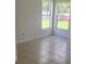 Bright bedroom with two large windows overlooking the backyard at 2401 Cedarfield Ln, Kissimmee, FL 34744