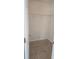 Walk-in closet with durable tile floors and wire rack shelving at 2401 Cedarfield Ln, Kissimmee, FL 34744