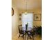 Bright dining area with a wooden table, chandelier and a large window for plenty of natural light at 2704 Kendall Ave, Kissimmee, FL 34744