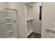 Walk-in closet beside a glass-enclosed shower at 2722 Numa Falls Ave, Davenport, FL 33837
