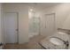 Bathroom with granite counters, double sinks and a glass enclosed shower at 2722 Numa Falls Ave, Davenport, FL 33837