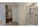Bathroom featuring a walk-in closet, and a glass-enclosed shower at 2722 Numa Falls Ave, Davenport, FL 33837