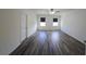Airy bedroom with stylish wood-look floors, a ceiling fan, and neutral decor at 2722 Numa Falls Ave, Davenport, FL 33837