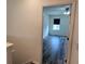 Bright bedroom with wood-look floors, a ceiling fan, and a sunny window at 2722 Numa Falls Ave, Davenport, FL 33837