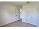 Bedroom with neutral paint and closet with double doors at 2722 Numa Falls Ave, Davenport, FL 33837