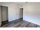 A bedroom features wood floors and a closet at 2722 Numa Falls Ave, Davenport, FL 33837