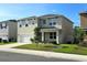 Corner lot home featuring a manicured lawn and an attached two-car garage at 2722 Numa Falls Ave, Davenport, FL 33837