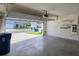 A clean two-car garage offering ample space with automatic door opener and storage at 2722 Numa Falls Ave, Davenport, FL 33837