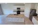 This kitchen features a large granite island and stainless steel appliances at 2722 Numa Falls Ave, Davenport, FL 33837