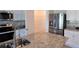Modern kitchen features stainless steel appliances, granite countertops, and walk-in pantry at 2722 Numa Falls Ave, Davenport, FL 33837