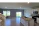 Open-concept kitchen featuring granite countertops and stainless steel appliances at 2722 Numa Falls Ave, Davenport, FL 33837