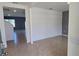 Open-concept living area featuring tile floors and neutral paint, creating a bright and airy space at 2722 Numa Falls Ave, Davenport, FL 33837
