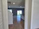 Open-concept living area featuring tile floors and neutral paint, seamlessly flowing into the kitchen at 2722 Numa Falls Ave, Davenport, FL 33837