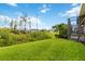 Expansive backyard offering serene views of lush greenery and mature trees at 2736 Southland St, St Cloud, FL 34772