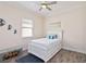 Charming bedroom with white furnishings, a decorative rug, and a window that provides natural light, creating a cozy space at 2736 Southland St, St Cloud, FL 34772