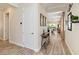 Elegant foyer with wood-look tile, leading to a dining area and living room beyond at 2736 Southland St, St Cloud, FL 34772