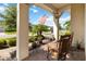 Charming front porch with rocking chairs, potted plants, and views of a manicured lawn and American flag at 2736 Southland St, St Cloud, FL 34772