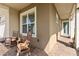 Welcoming front porch with rocking chairs, potted plants, and a view of the front yard at 2736 Southland St, St Cloud, FL 34772