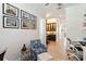 Stylish hallway featuring wood-look tile floors, recessed lighting, and a built-in bar with dark cabinetry at 2736 Southland St, St Cloud, FL 34772