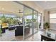 Beautiful outdoor living space with a screened-in lanai and brick patio with outdoor kitchen and living area at 2736 Southland St, St Cloud, FL 34772