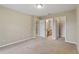 Spacious bedroom with an ensuite bathroom and walk-in closet, providing ample storage and convenience at 2832 Osprey Cove Pl # 102, Kissimmee, FL 34746