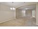 Bright living room featuring neutral carpet and paint at 2832 Osprey Cove Pl # 102, Kissimmee, FL 34746