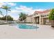 Community pool with lounge chairs, shade and lush landscaping at 2832 Osprey Cove Pl # 102, Kissimmee, FL 34746