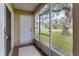 Screened porch with view of a large yard at 2832 Osprey Cove Pl # 102, Kissimmee, FL 34746