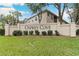 Osprey Cove entrance sign surrounded by manicured green lawn and mature trees at 2832 Osprey Cove Pl # 102, Kissimmee, FL 34746